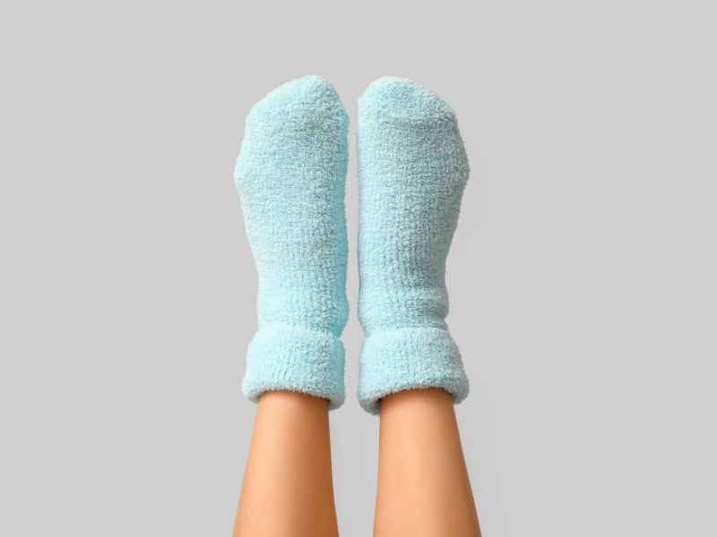 putting on socks after rollerball bottle treatment