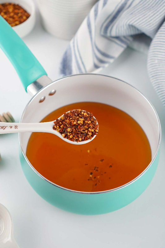 Adding spice (crushed red peppers)
